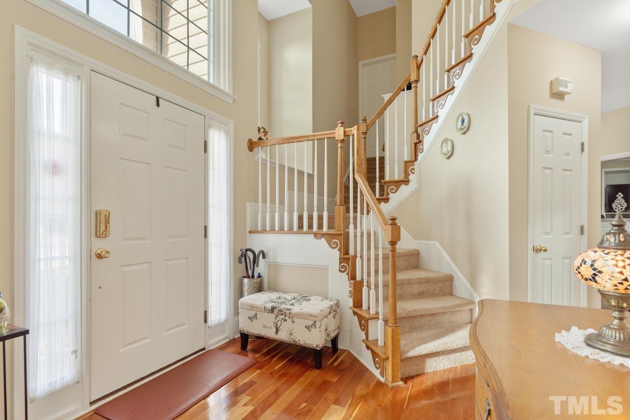 468 Seastone Street Raleigh, NC 27603 - Photo 7 of 28 a view of entryway bedroom and hall with wooden floor