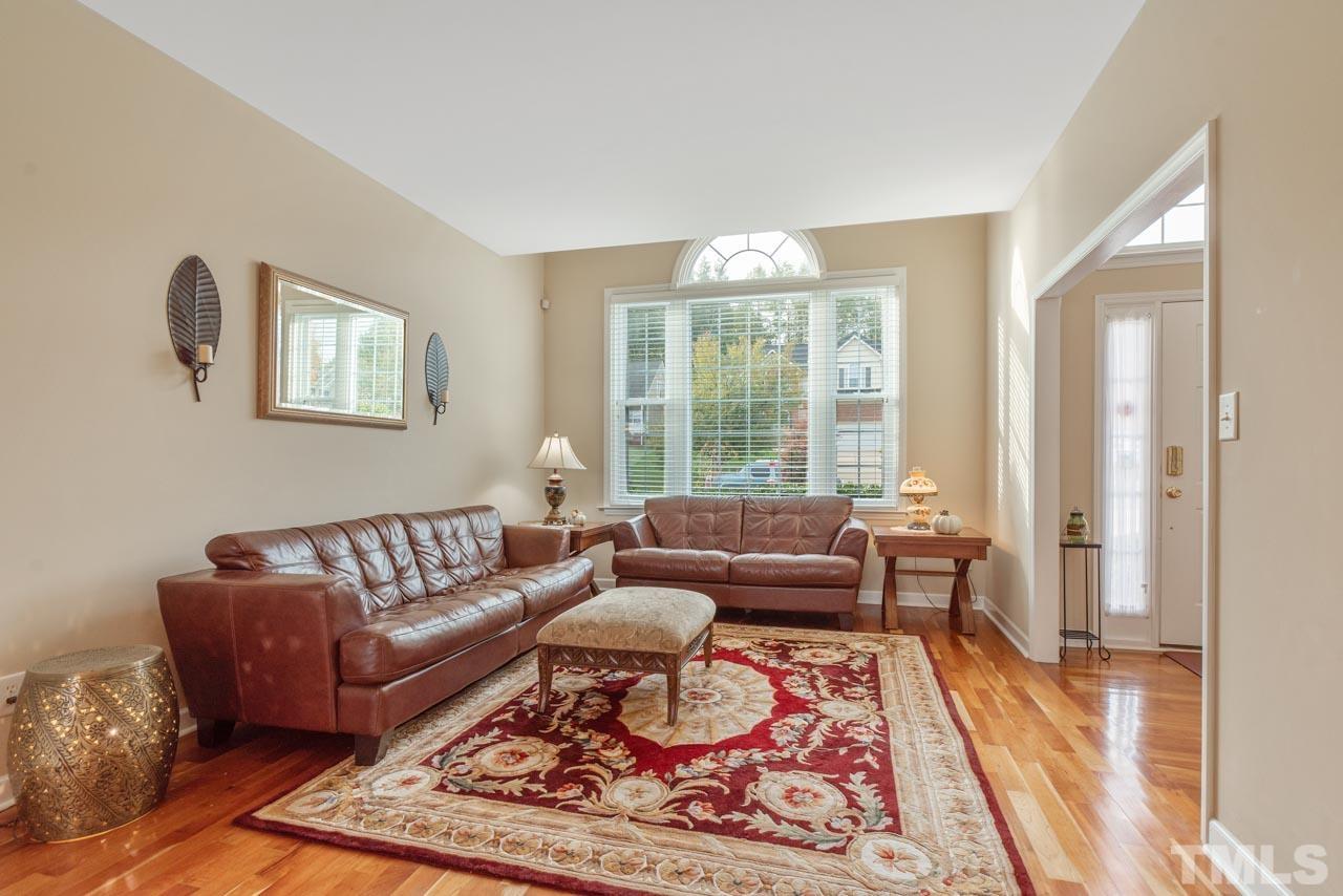 468 Seastone Street Raleigh, NC 27603 - Photo 8 of 28 a living room with furniture and a rug
