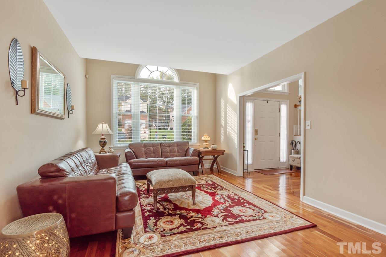 468 Seastone Street Raleigh, NC 27603 - Photo 9 of 28 a living room with furniture and a rug