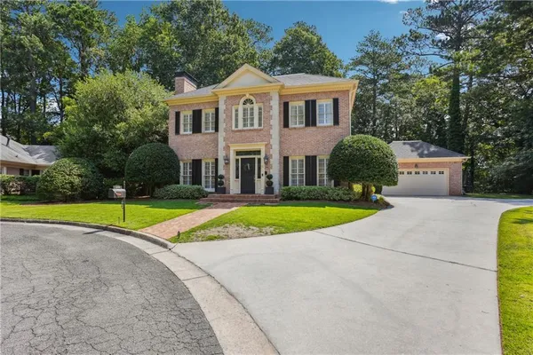 a view of house with outdoor space and porch