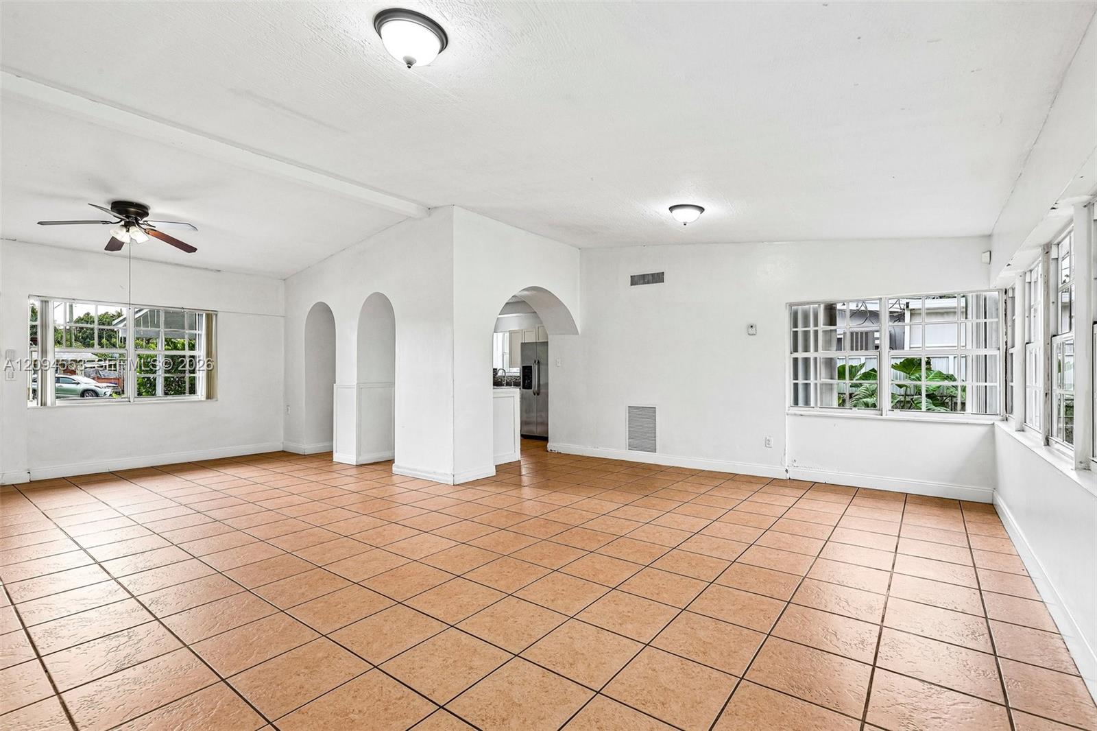 571 Northeast 172nd Street North Miami Beach, FL 33162 - Photo 9 of 33 Great room, unstaged (same room as photo 2)