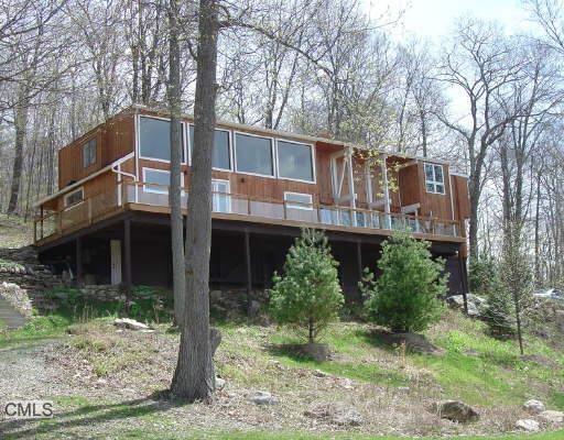 50 Chippewalla Road Kent, CT 06757 - Photo 1 of 1 a front view of a house with garden