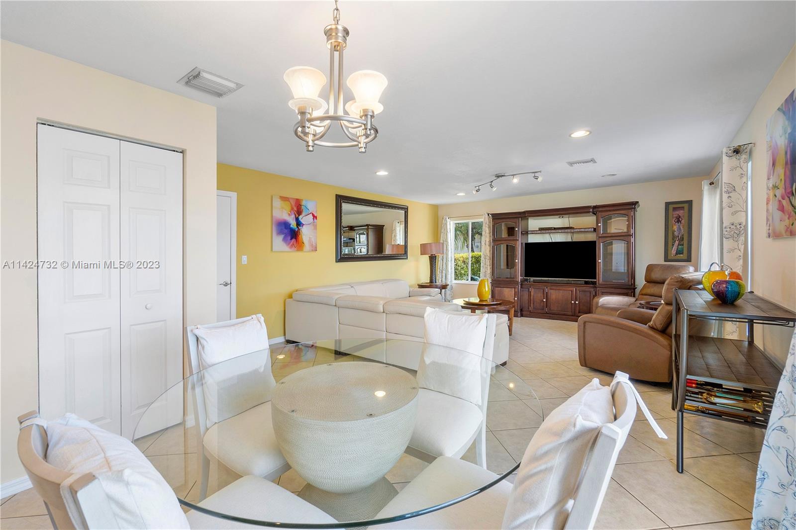 Silver Falls Miramar, FL 33027 - Photo 14 of 49 a living room with furniture kitchen view and a flat screen tv