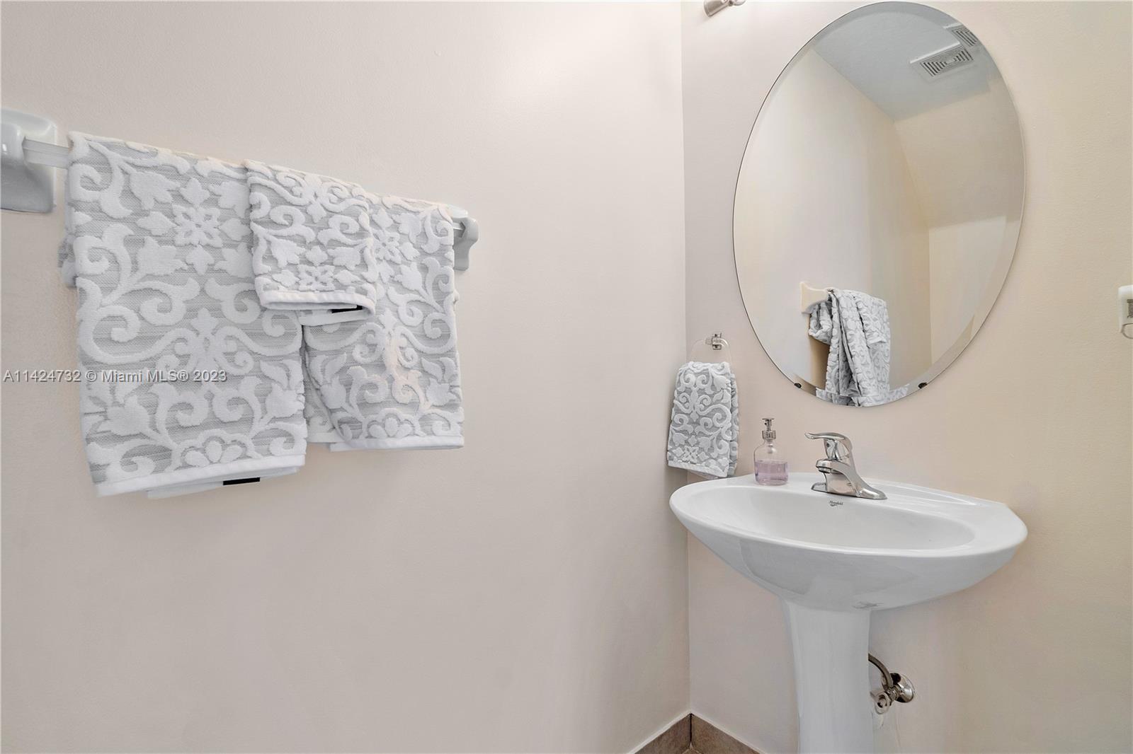 Silver Falls Miramar, FL 33027 - Photo 16 of 49 a bathroom with a sink and a mirror