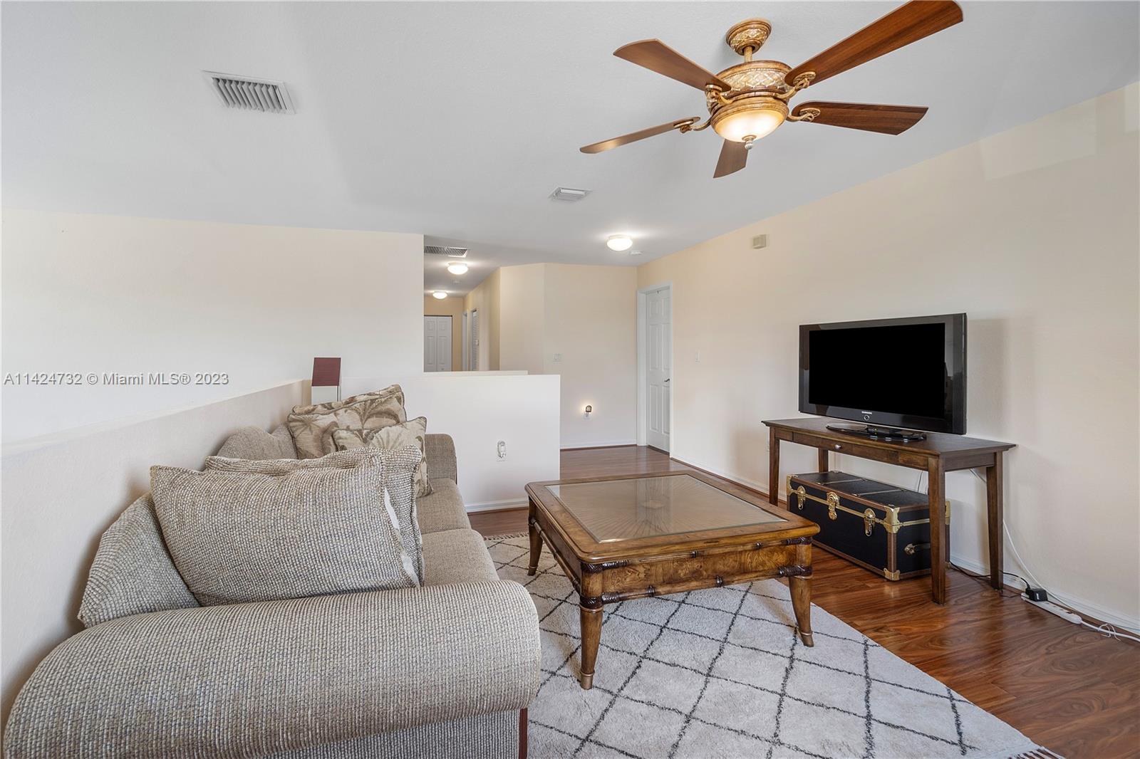 Silver Falls Miramar, FL 33027 - Photo 18 of 49 a living room with furniture and a flat screen tv