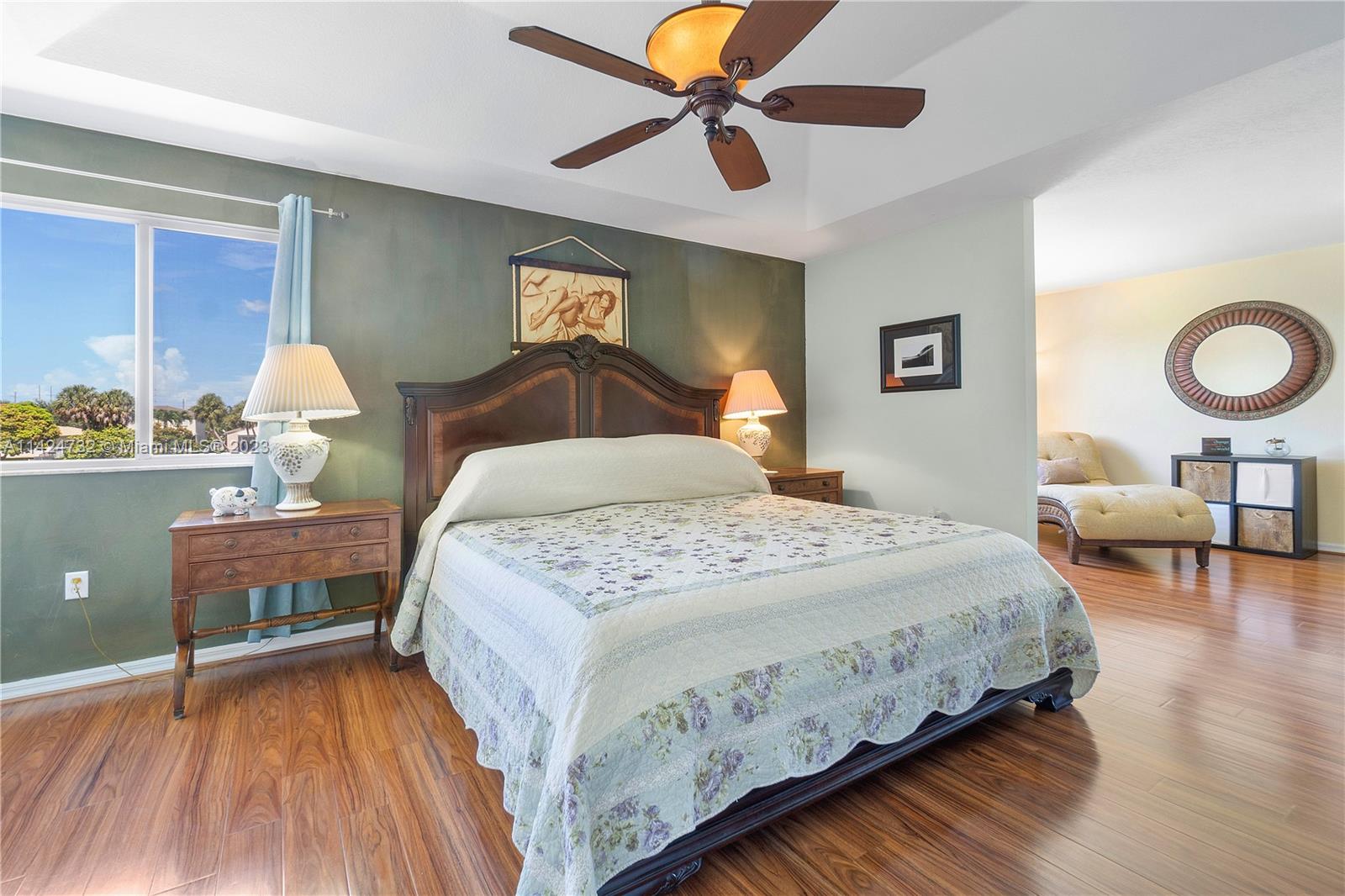 Silver Falls Miramar, FL 33027 - Photo 19 of 49 a bedroom with a bed and a chandelier