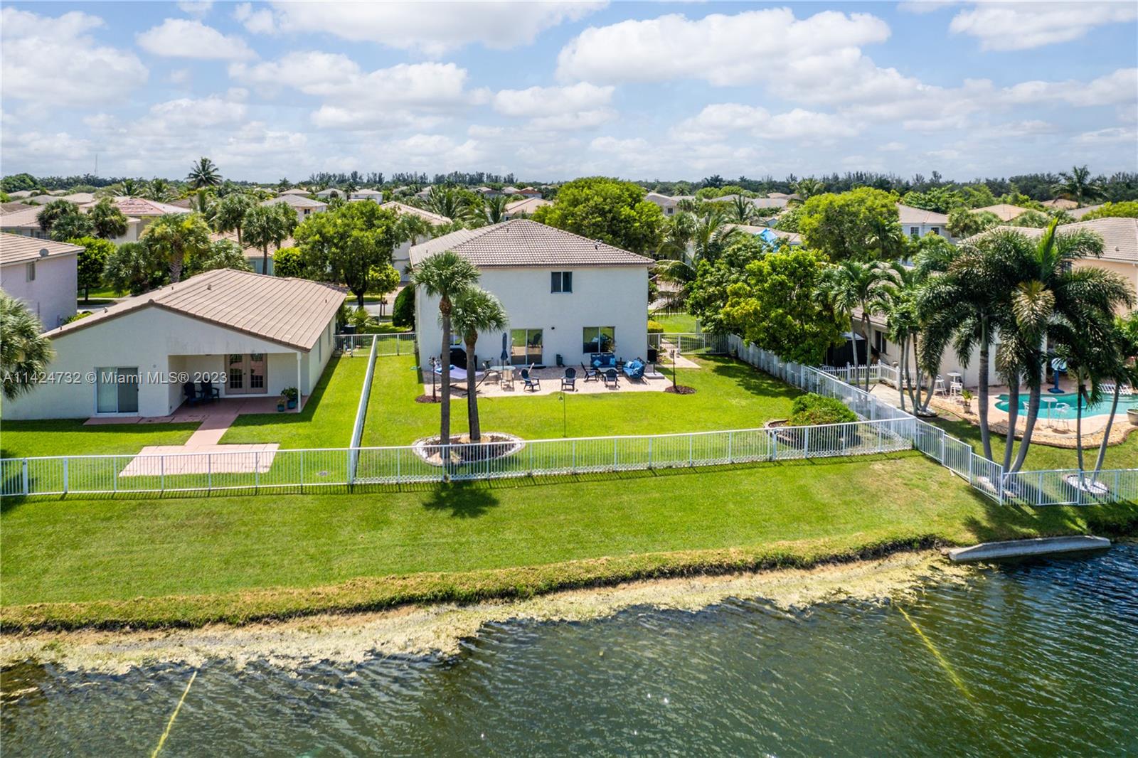 Silver Falls Miramar, FL 33027 - Photo 38 of 49 a view of a swimming pool with a yard