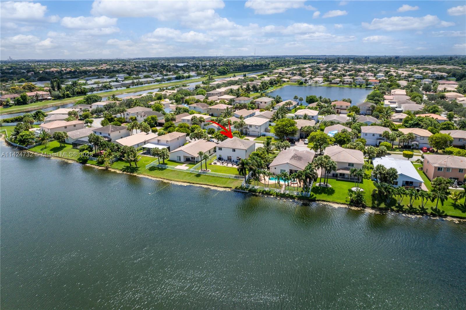 Silver Falls Miramar, FL 33027 - Photo 39 of 49 an aerial view of residential houses with outdoor space and lake view