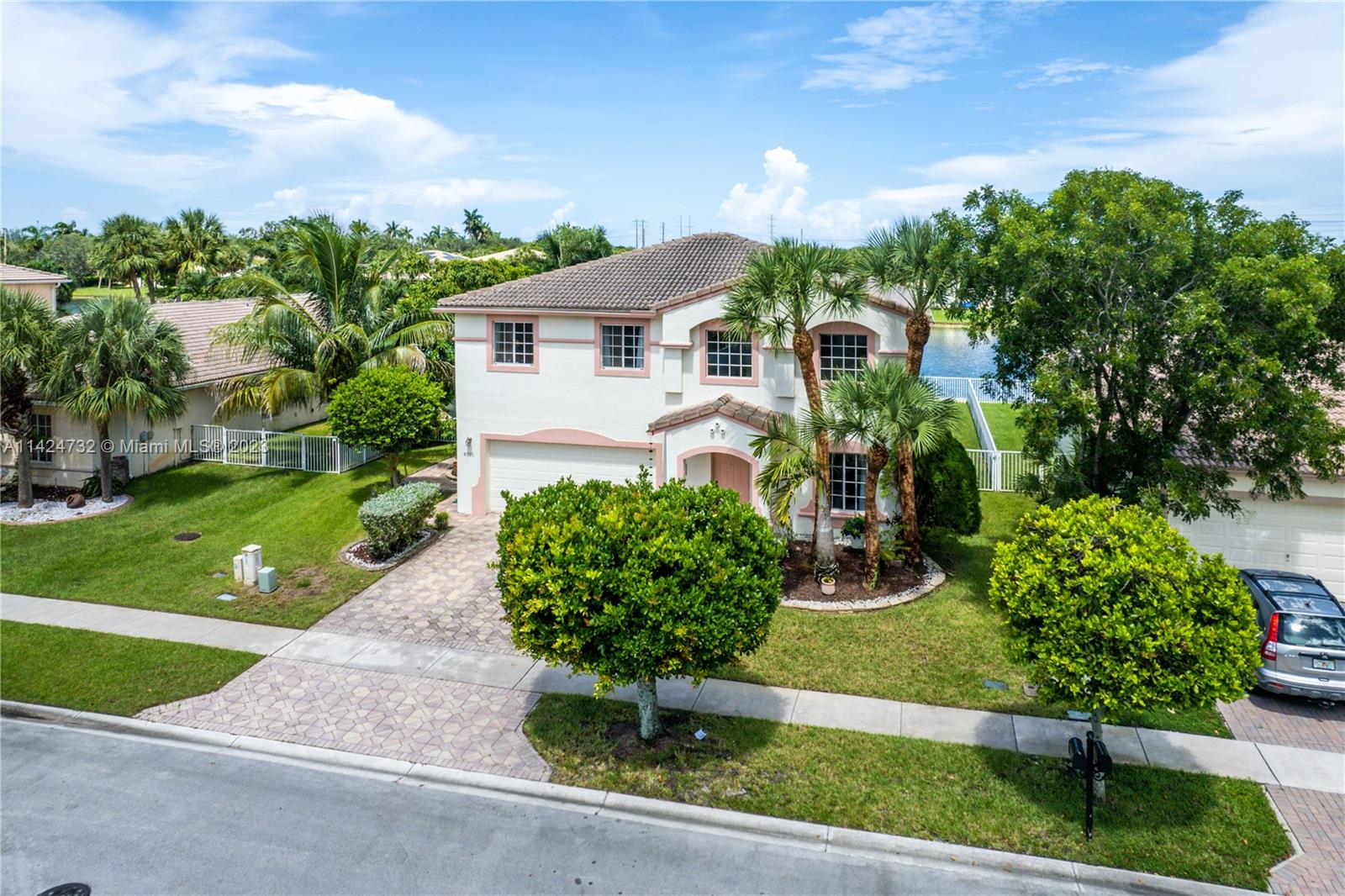 Silver Falls Miramar, FL 33027 - Photo 41 of 49 a front view of a house with a yard