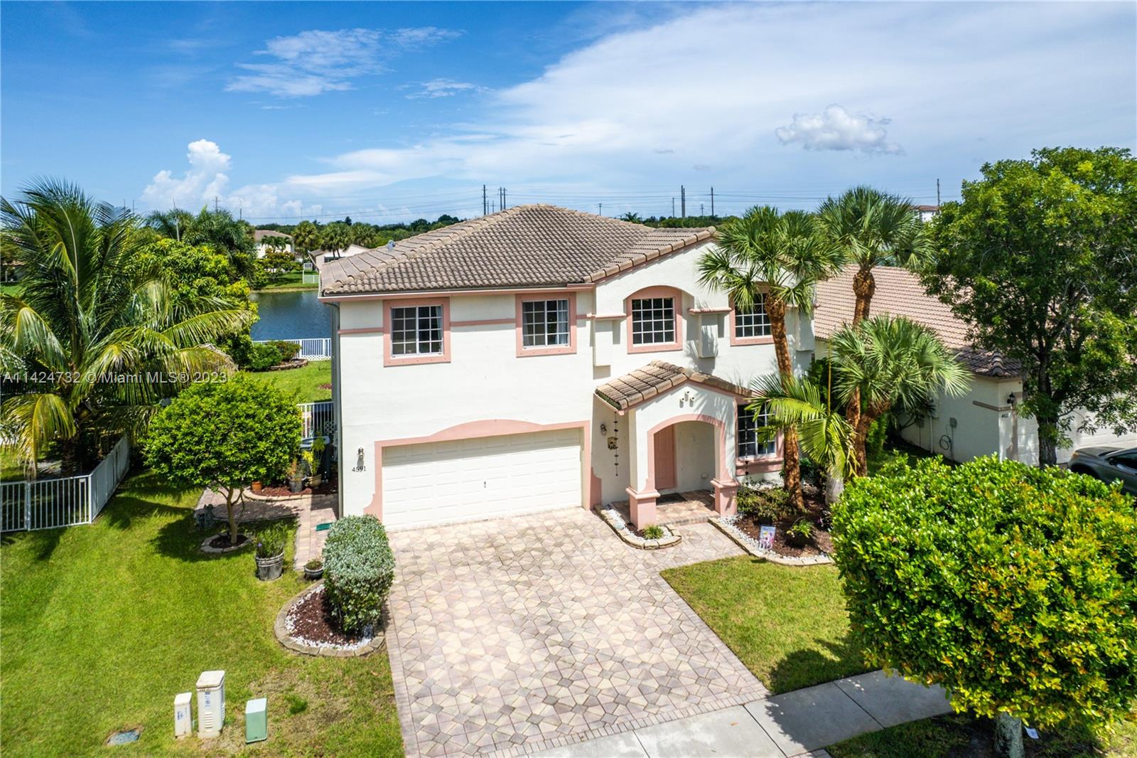 Silver Falls Miramar, FL 33027 - Photo 42 of 49 a front view of a house with a yard