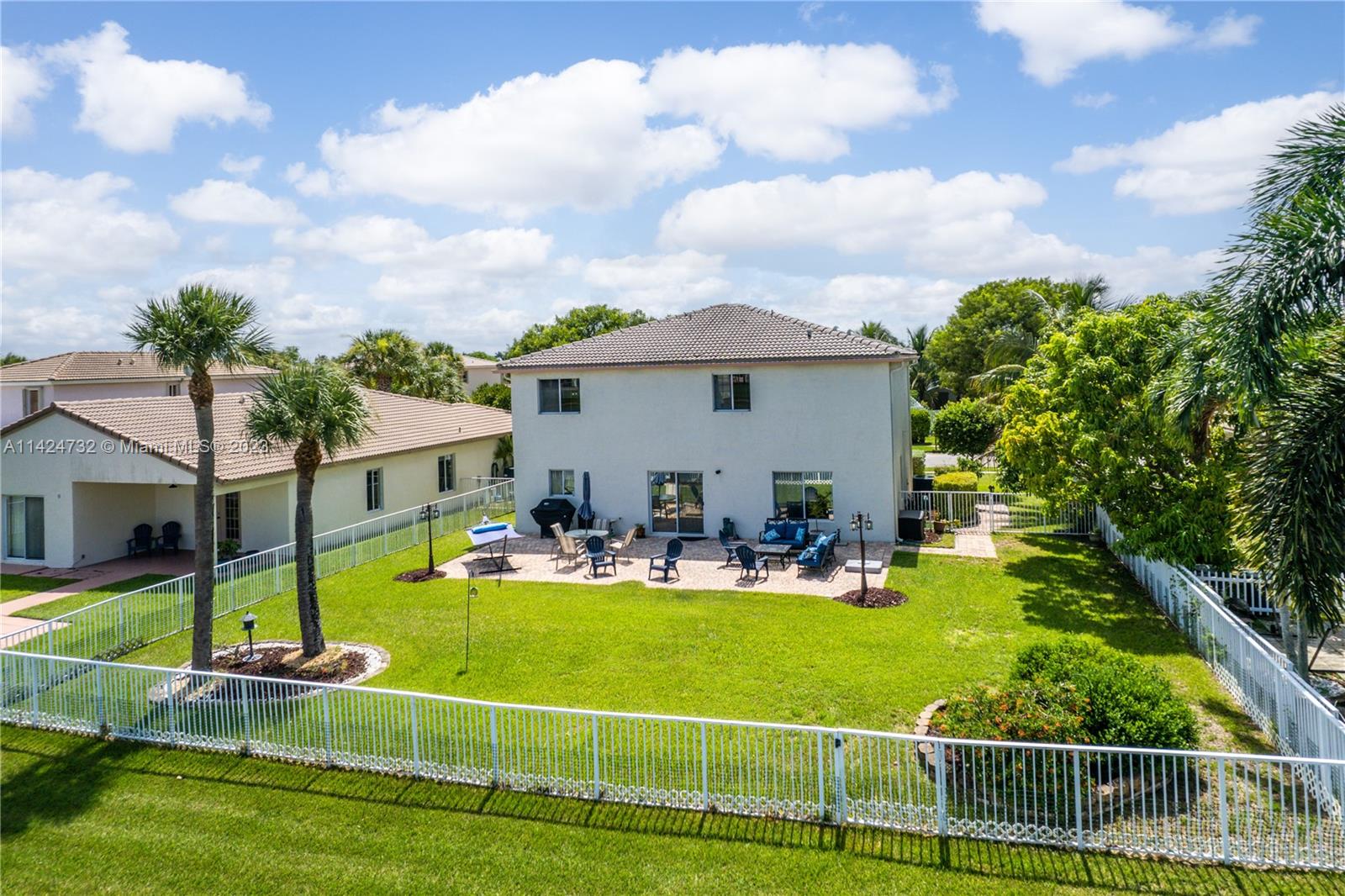 Silver Falls Miramar, FL 33027 - Photo 44 of 49 a view of a house with swimming pool and chairs
