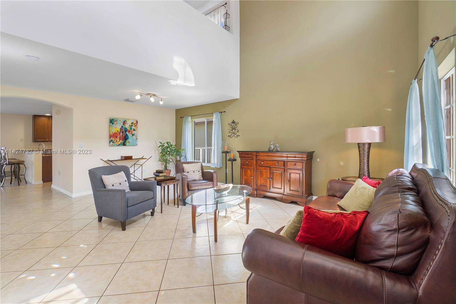 Silver Falls Miramar, FL 33027 - Photo 5 of 49 a living room with furniture and a lamp