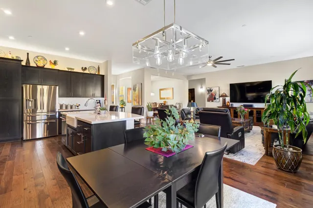 a kitchen with stainless steel appliances a sink stove and refrigerator