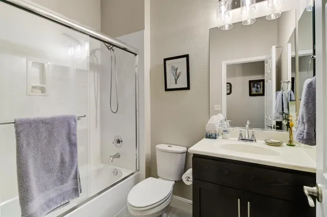 a work room with furniture and a potted plant