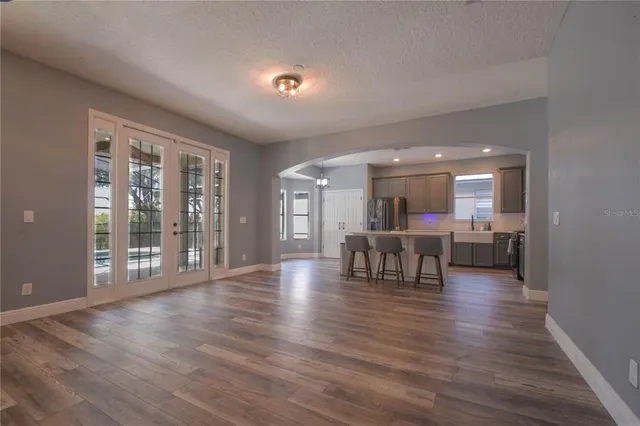 a view of dining room with furniture and wooden floor