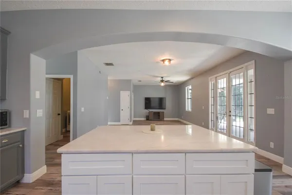 a room with a bed and a large window