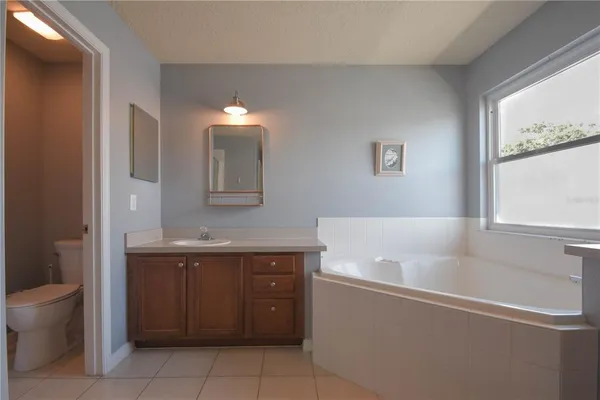 a bathroom with a bathtub sink and toilet