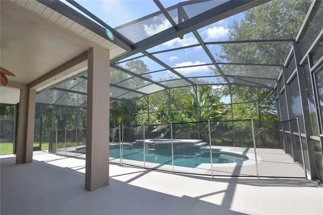a view of a room with wooden floor and windows