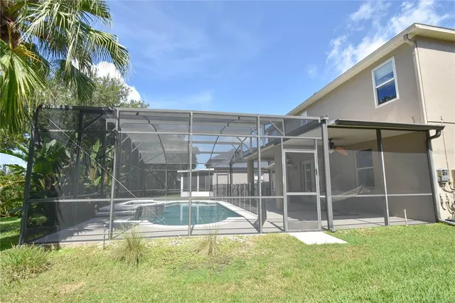 a view of a backyard with a large tree