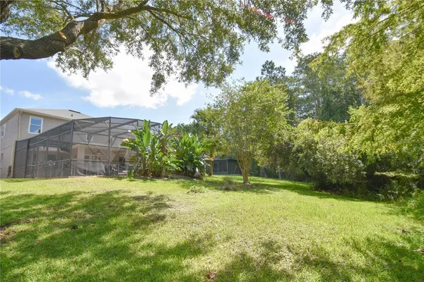 a backyard of a house with lots of green space