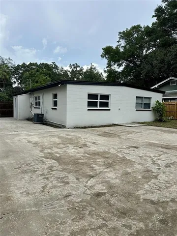 a house with trees in the background