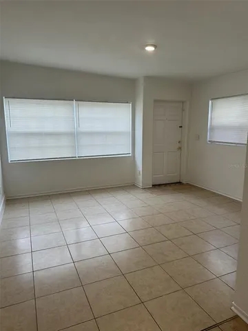 a view of room with window and shelf