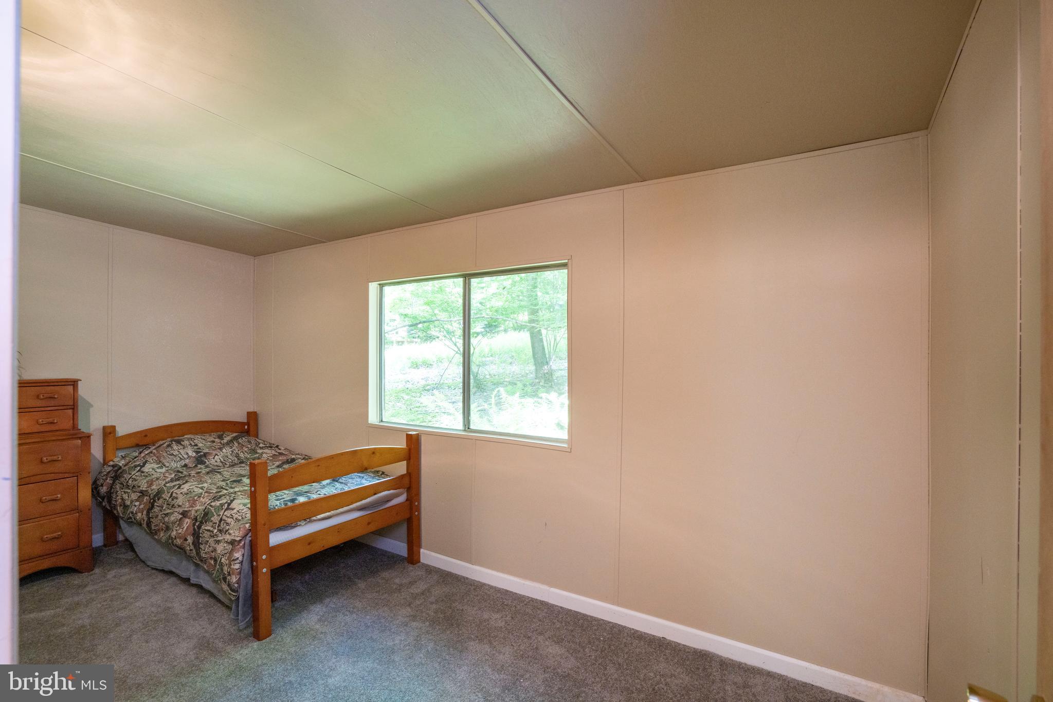 385 Elk Creek Road Aaronsburg, PA 16820 - Photo 34 of 71 a room with a bed and a window