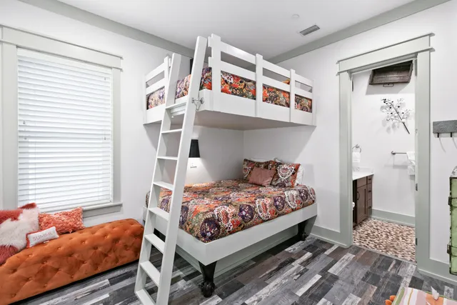 a living room with furniture a window and a clock