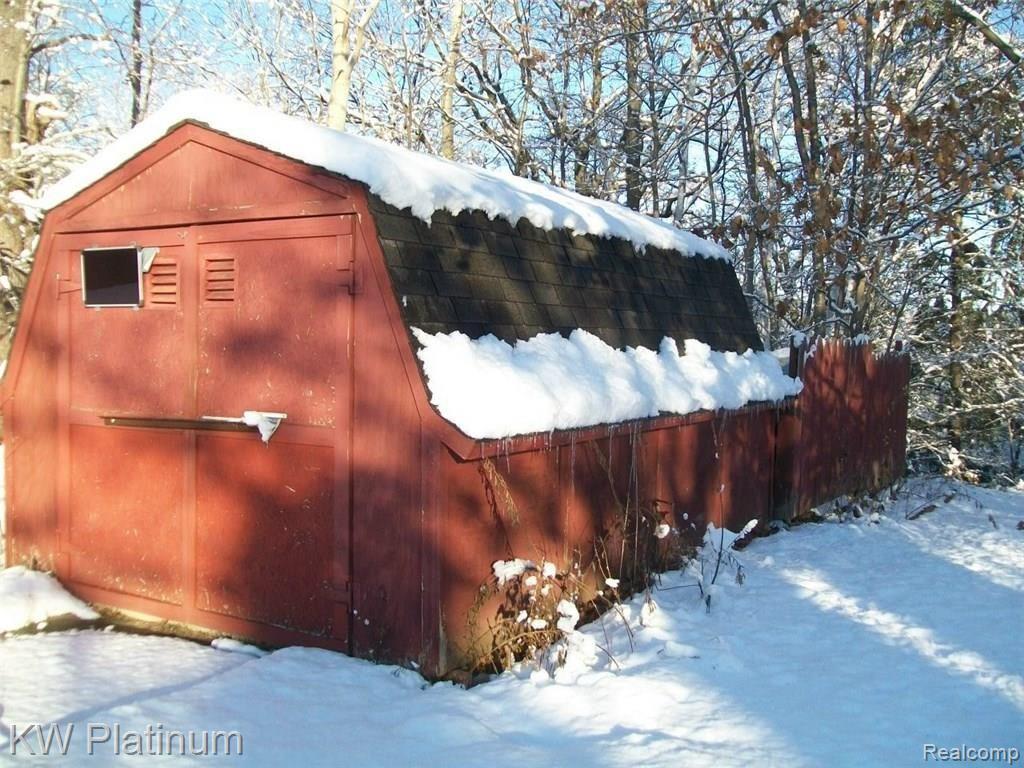7880 Graham Road Jeddo, MI 48032 - Photo 13 of 14 Large shed for storage of gardening or outdoor lawn equipment.