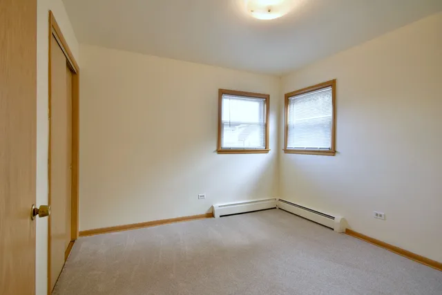an empty room with closet area