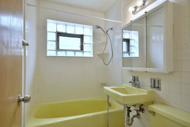 a bathroom with a sink toilet and a bathtub