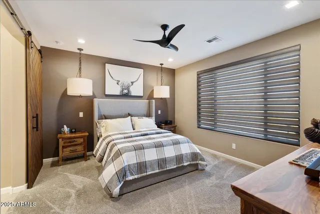 a bedroom with a bed and a desk