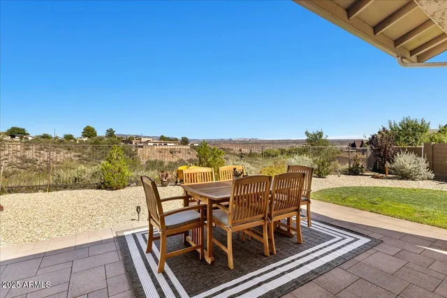 a view of a chairs and table on the terrace