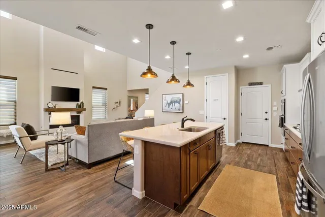 a kitchen with counter space and wooden floor