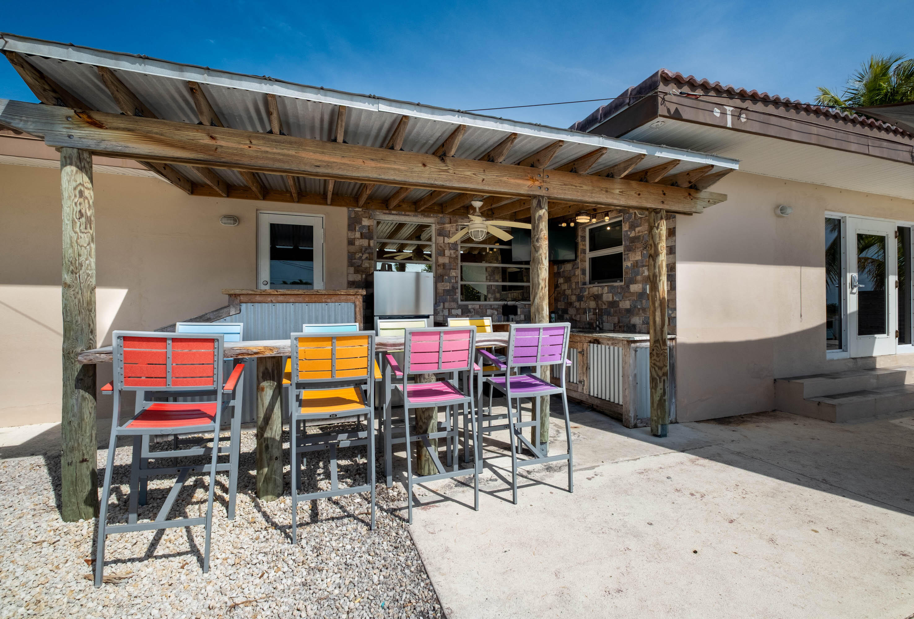 900 101st Street Marathon, FL 33050 - Photo 18 of 64 a view of a dinning tables and chairs in the patio