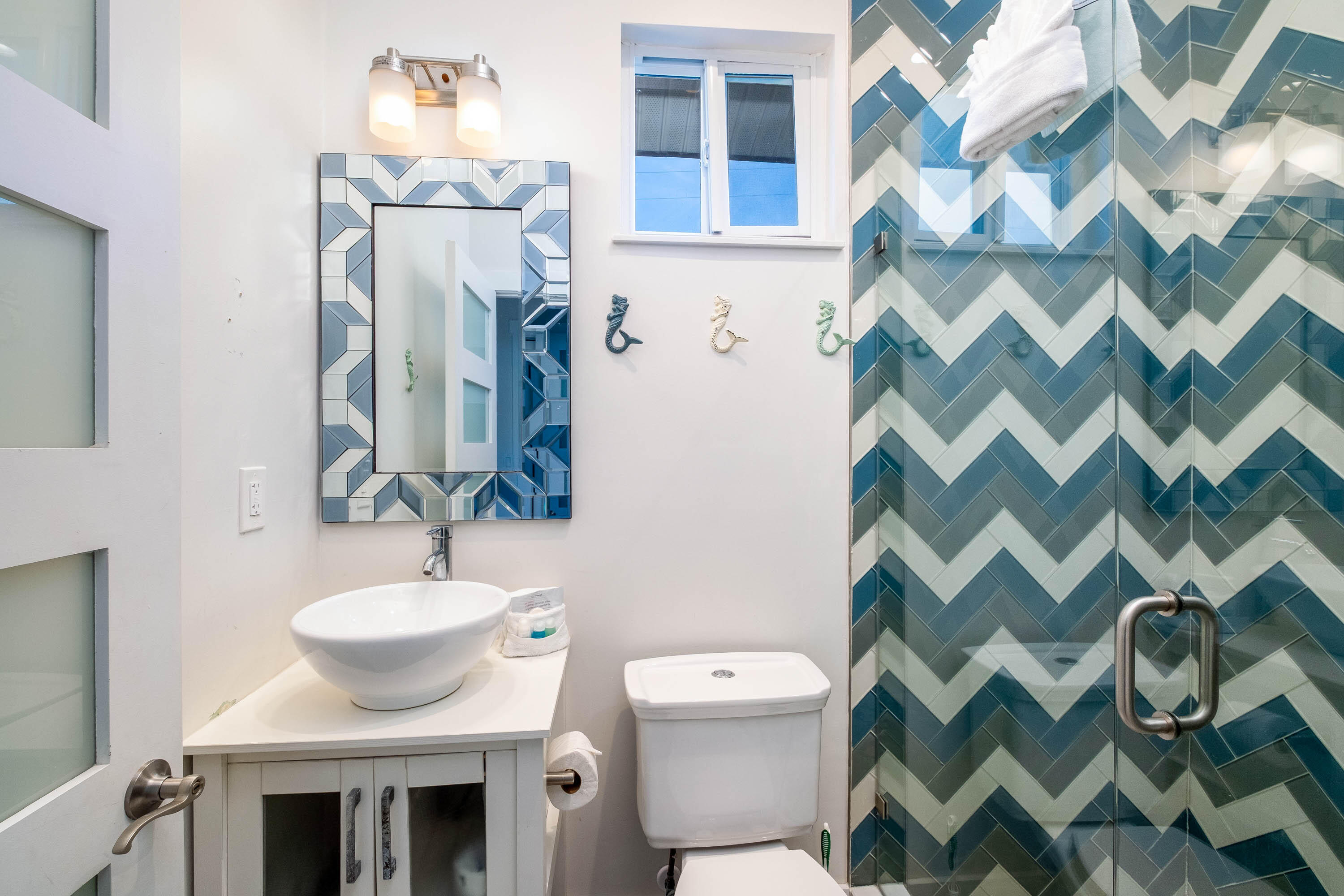 900 101st Street Marathon, FL 33050 - Photo 25 of 64 a bathroom with a sink and a mirror