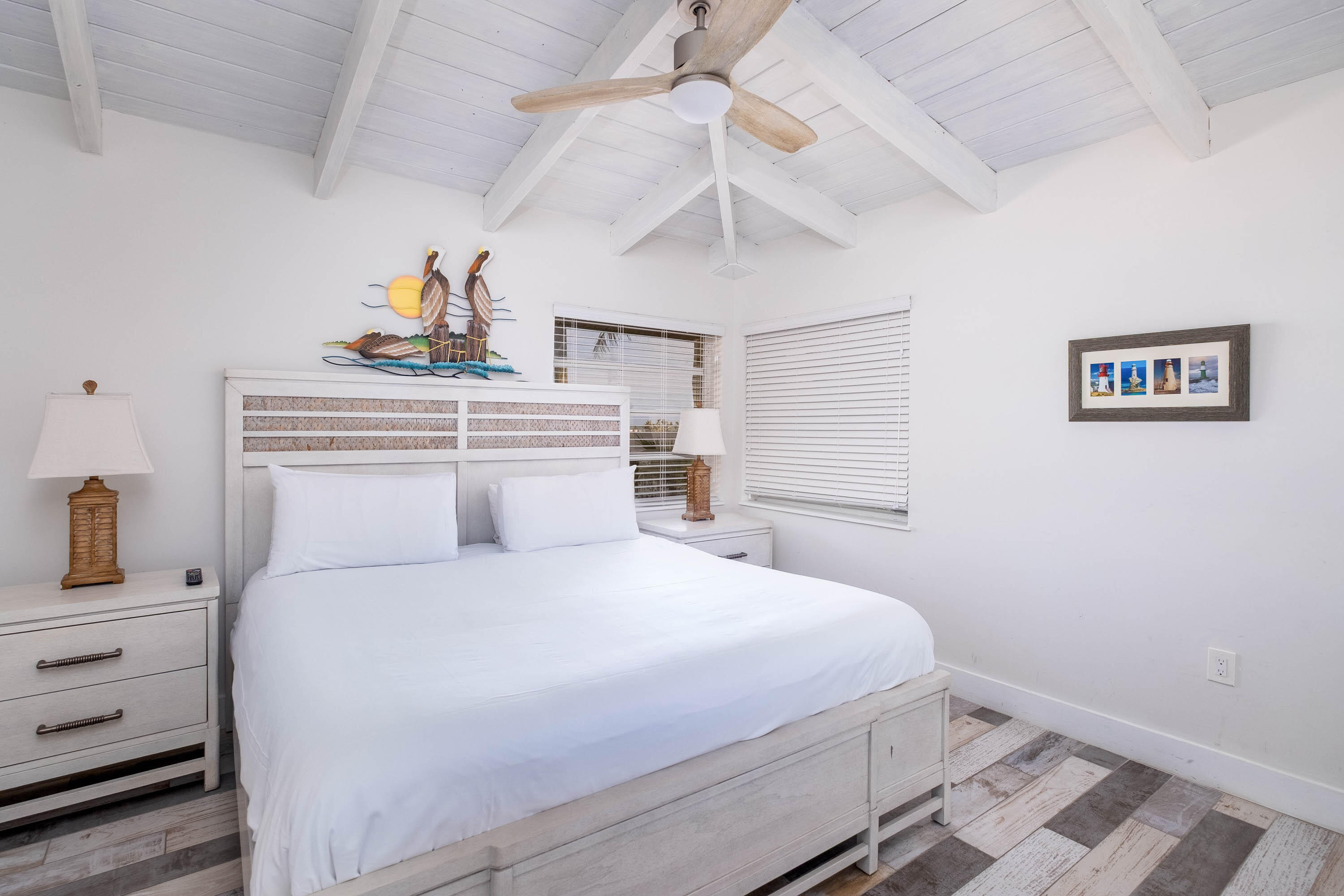 900 101st Street Marathon, FL 33050 - Photo 30 of 64 a bedroom with a bed and a chandelier