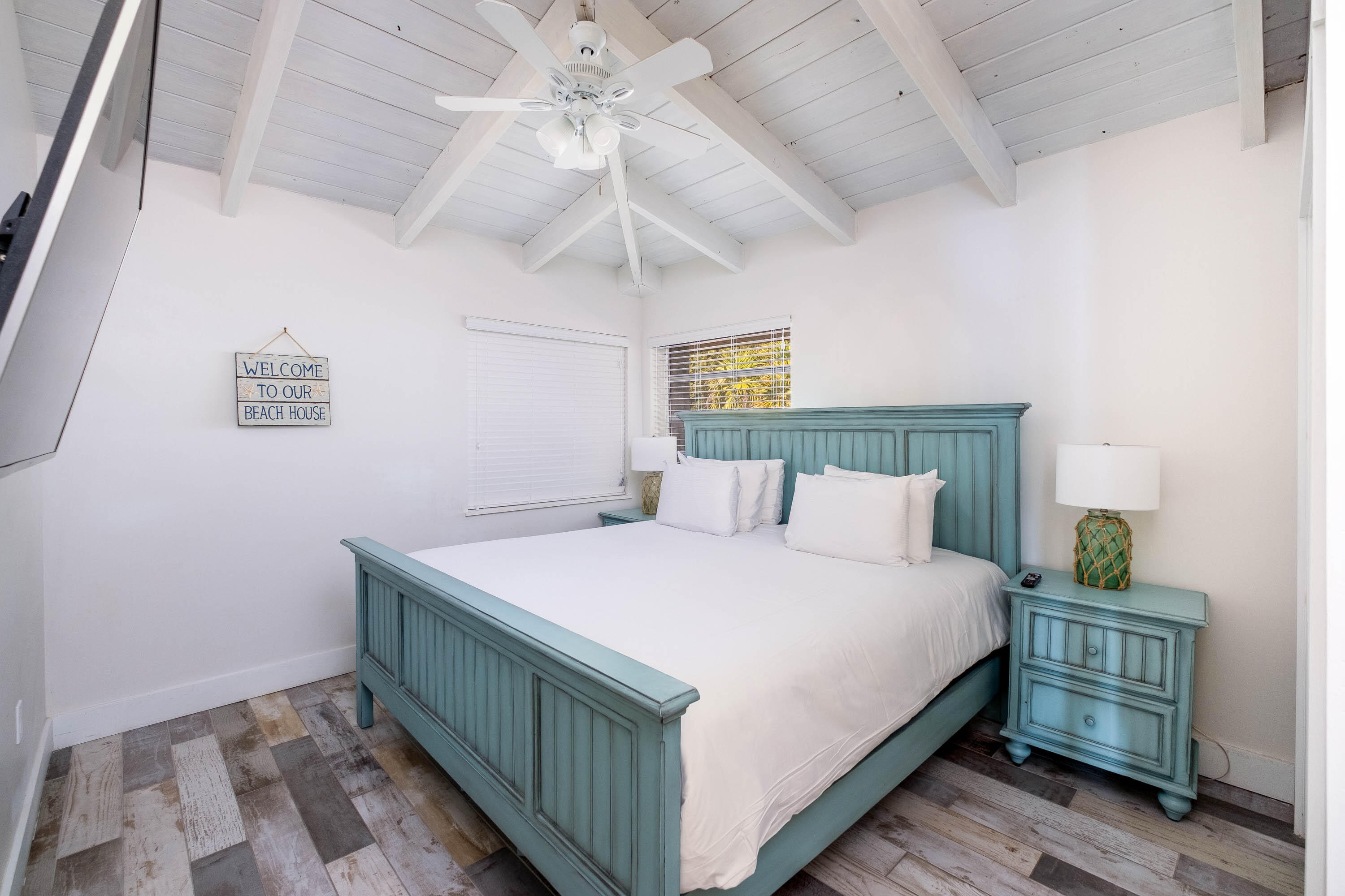 900 101st Street Marathon, FL 33050 - Photo 33 of 64 a bedroom with a bed and a chandelier