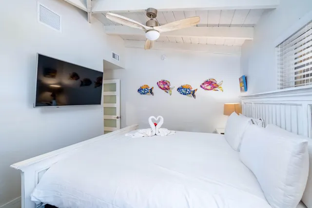 a bathroom with a toilet a sink and a shower