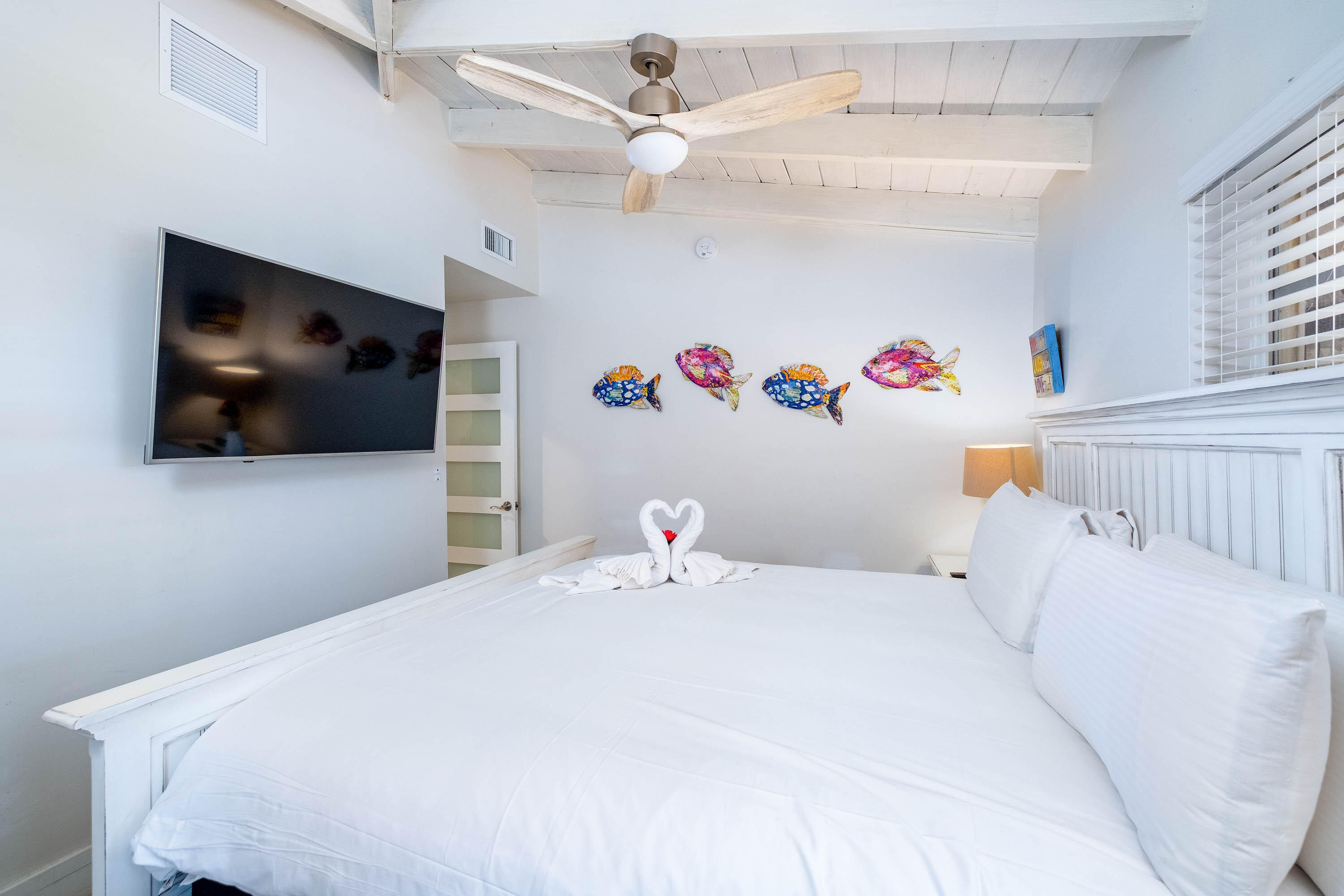 900 101st Street Marathon, FL 33050 - Photo 36 of 64 a bedroom with a bed and a flat screen tv