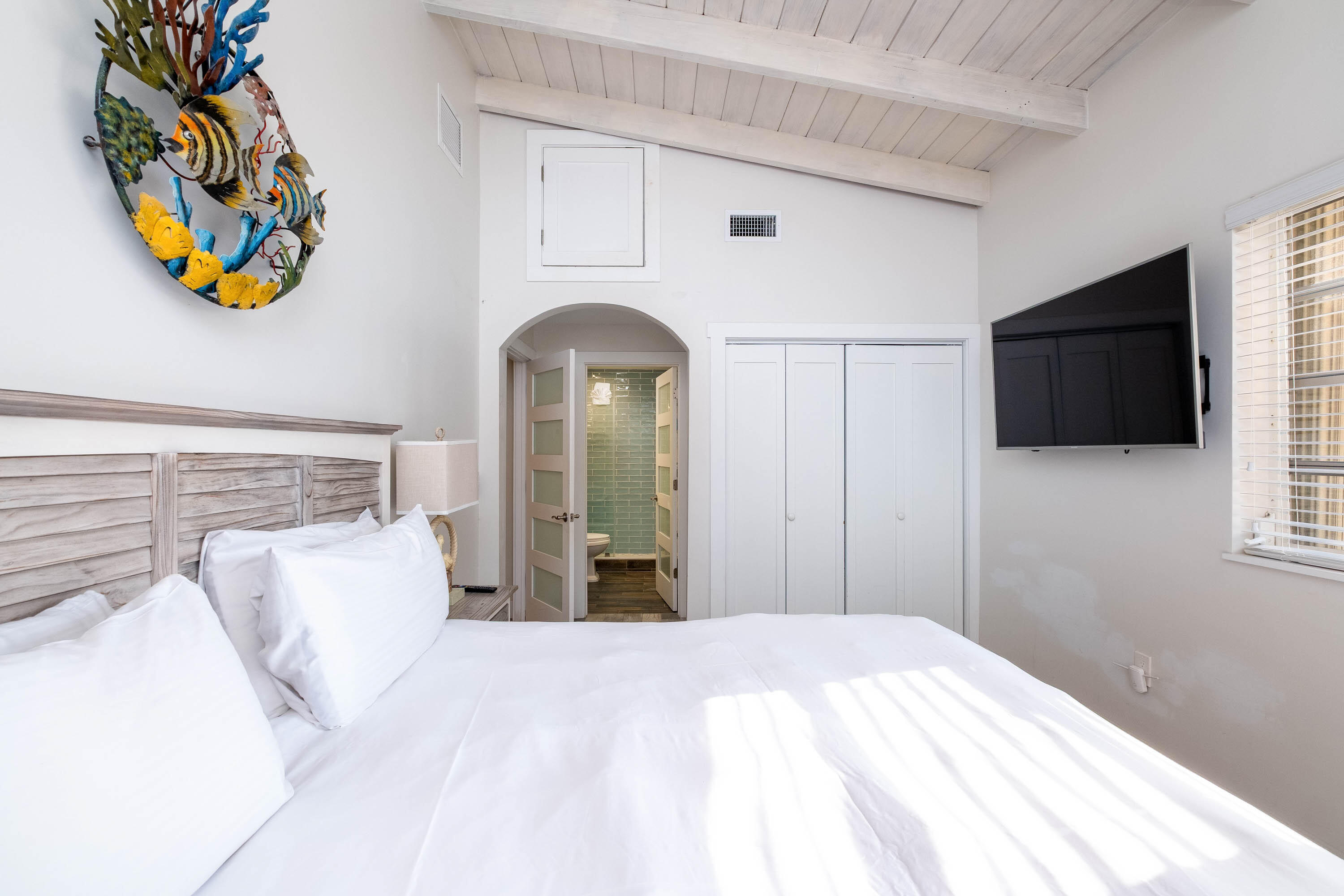 900 101st Street Marathon, FL 33050 - Photo 39 of 64 a bedroom with a bed and a flat screen tv