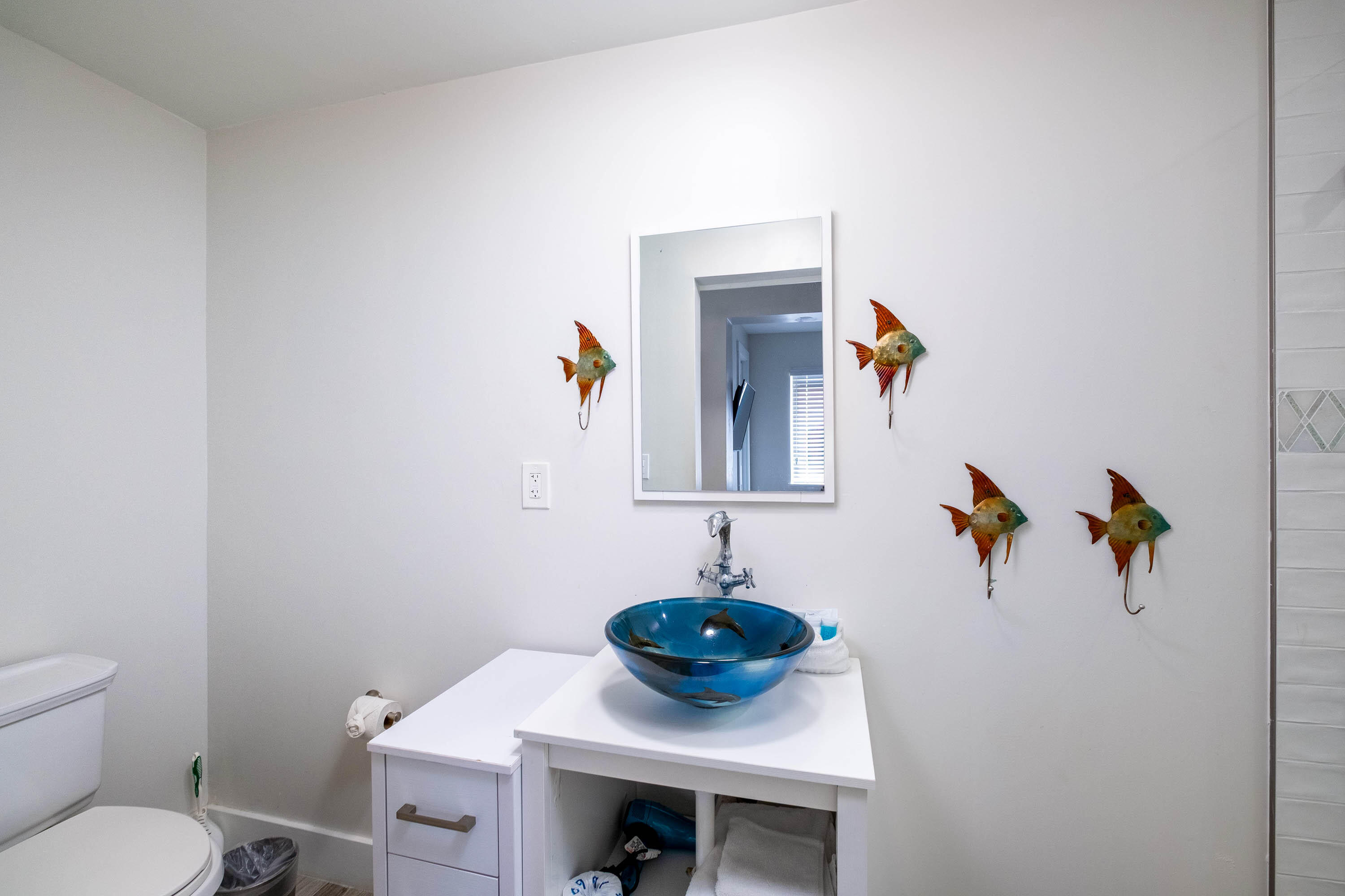 900 101st Street Marathon, FL 33050 - Photo 4 of 64 a bathroom with a sink a toilet and mirror