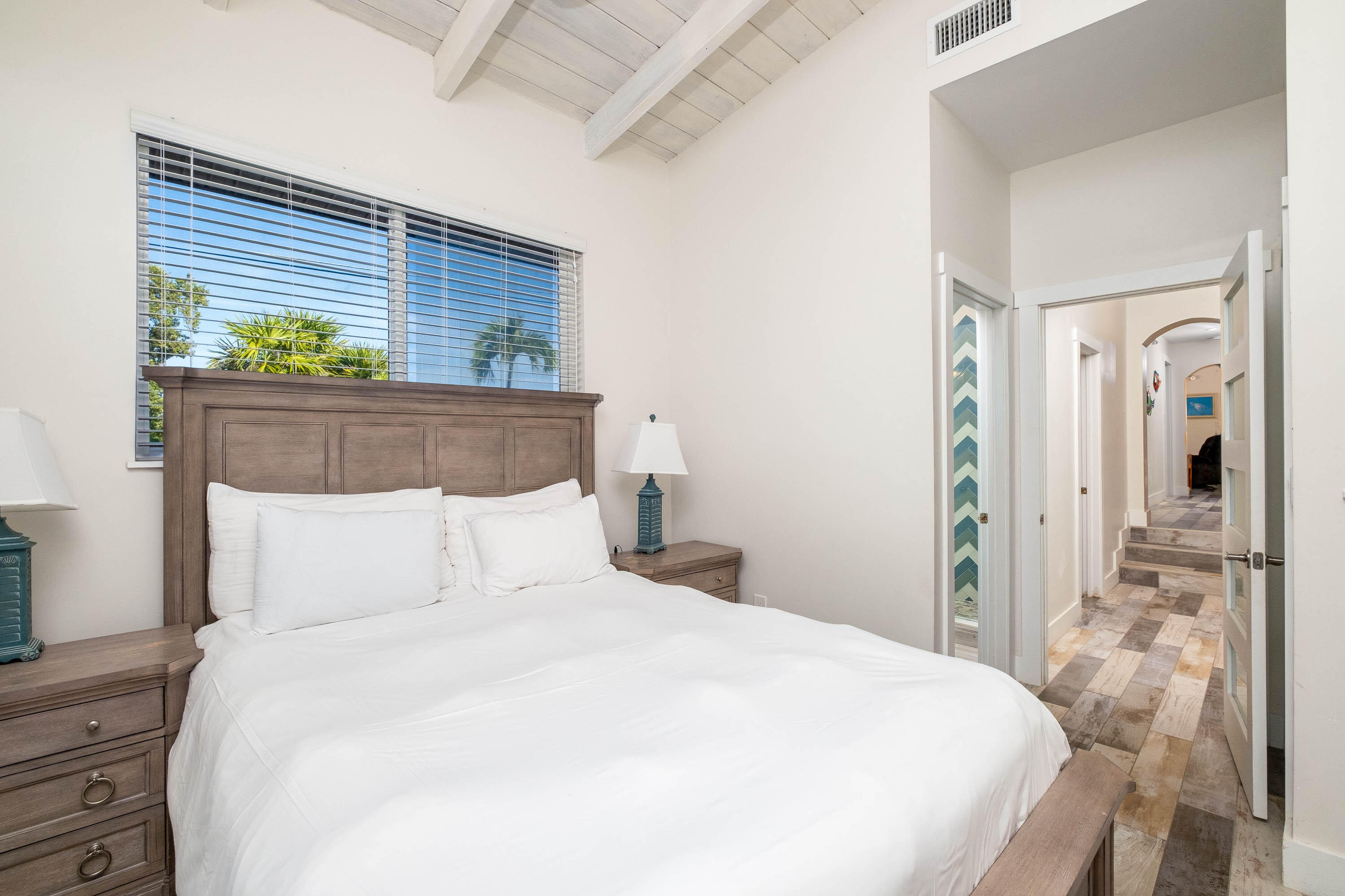 900 101st Street Marathon, FL 33050 - Photo 42 of 64 a bedroom with a bed and a potted plant