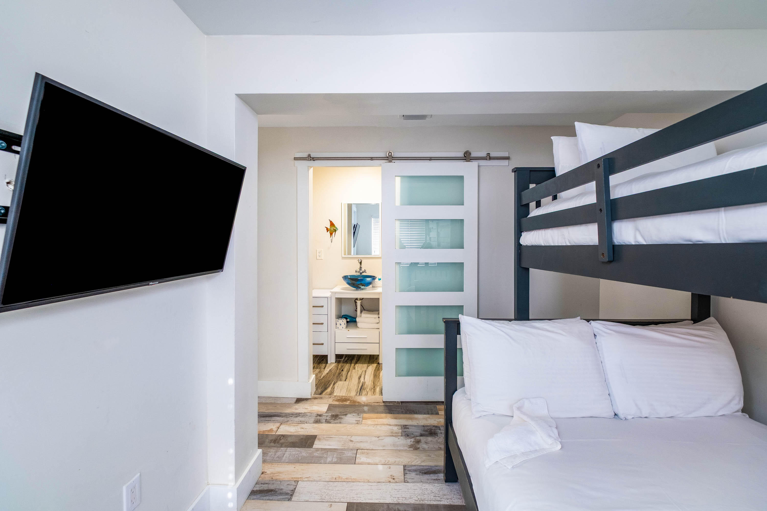 900 101st Street Marathon, FL 33050 - Photo 6 of 64 a living room with a flat screen tv and a fireplace