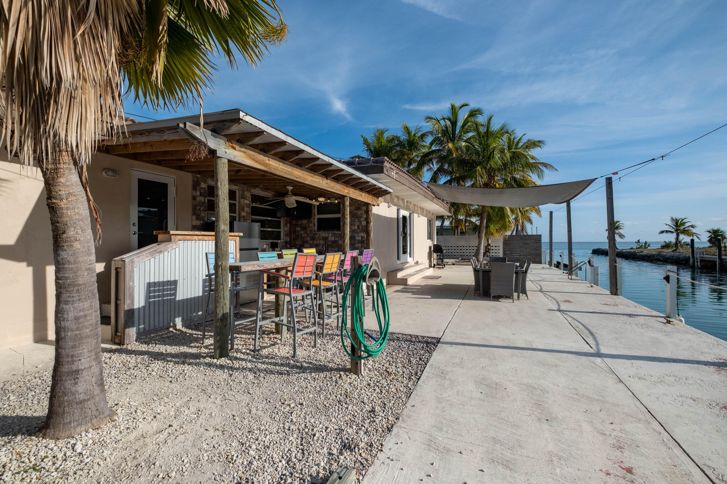 900 101st Street Marathon, FL 33050 - Photo 9 of 64 a view of a backyard with a patio