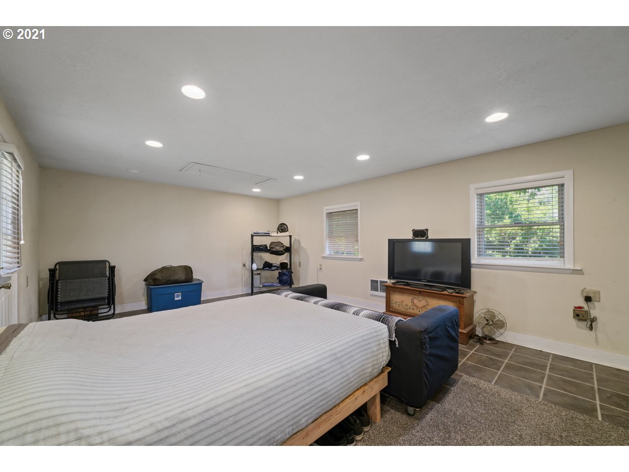 6694 Labish Center Road Northeast Salem, OR 97305 - Photo 14 of 32 a bedroom with a bed and a flat screen tv