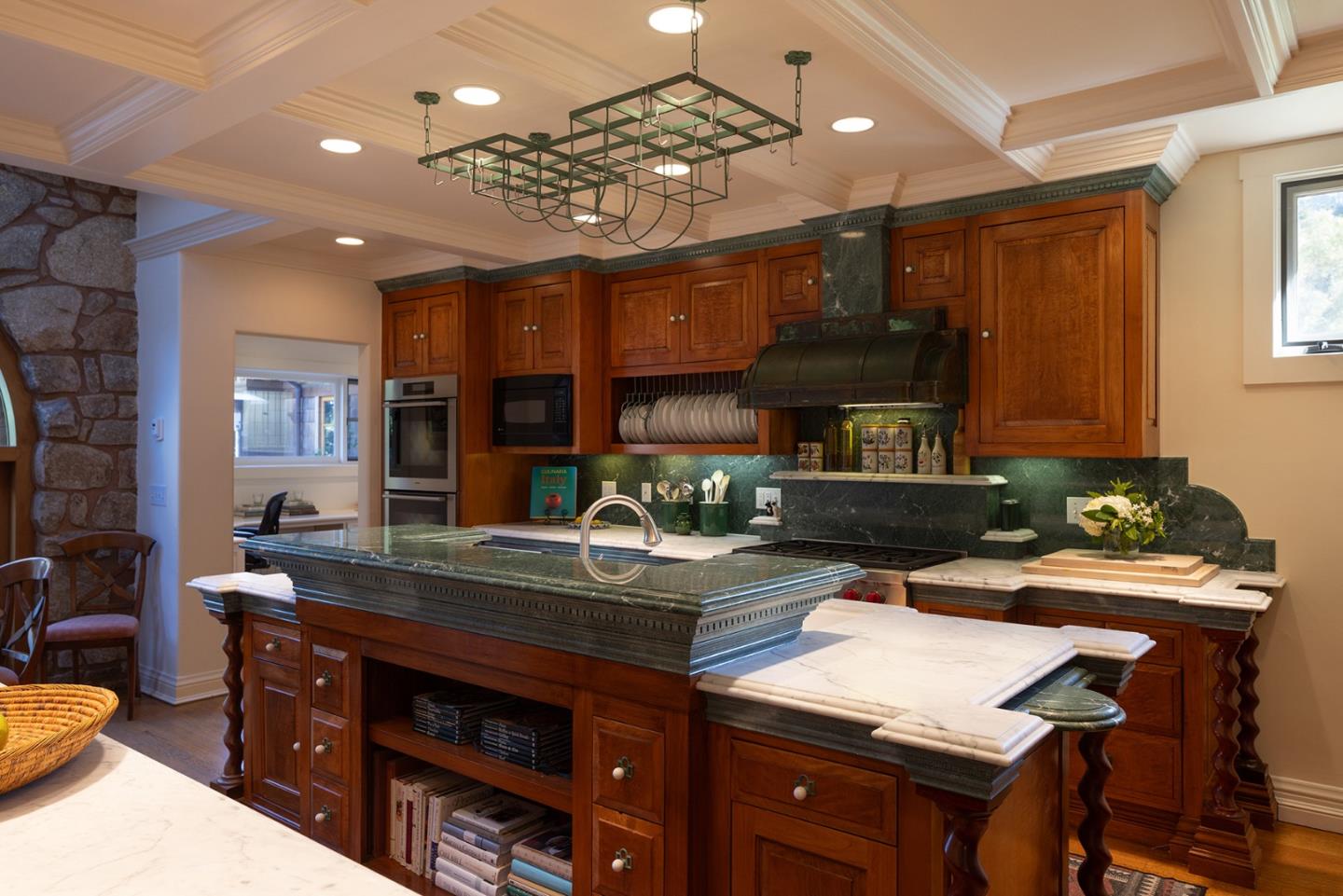72 Fern Canyon Road Carmel, CA 93923 - Photo 19 of 66 a kitchen with a table chairs stove and cabinets