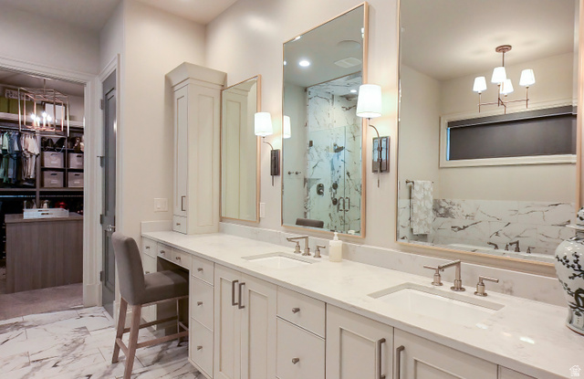 3 Carriagewood Cove, Unit 1088 Sandy, UT 84092 - Photo 30 of 79 Dual vanity with undermount sinks and light-toned countertops