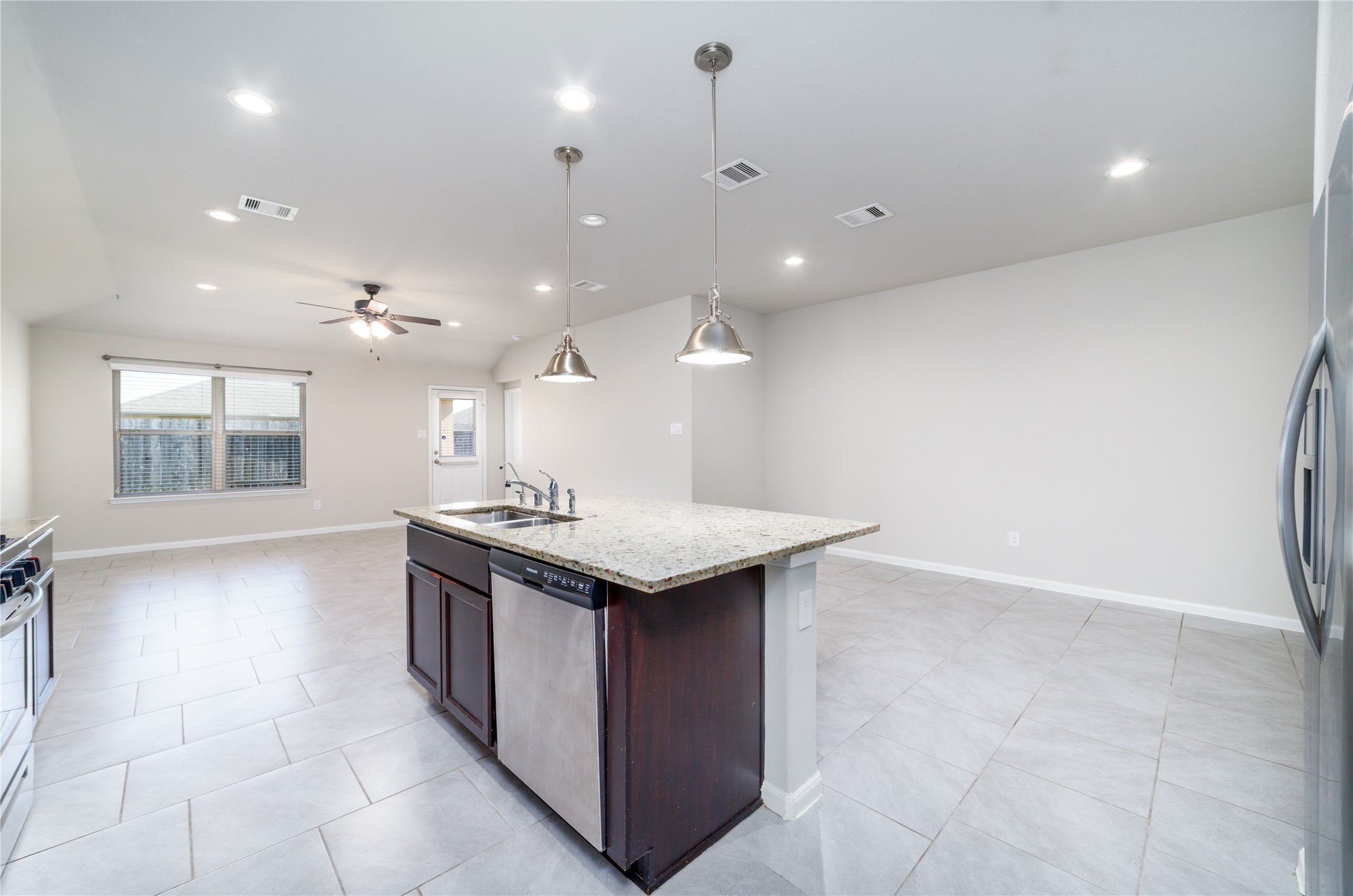 8307 Oakleaf Meadow Court Rosharon, TX 77583 - Photo 14 of 39 a kitchen with a stove and a sink