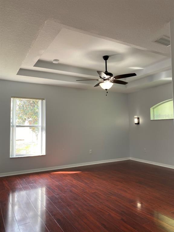 12 Prairie Lane Palm Coast, FL 32164 - Photo 17 of 41 wooden floor in an empty room with a window